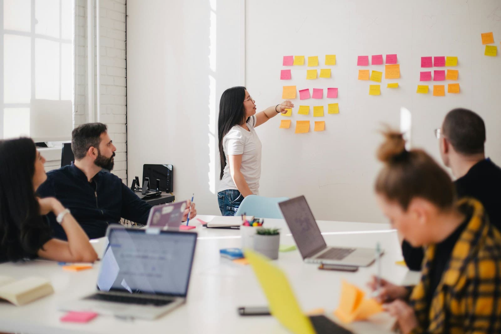 Team mapping strategy notes together in a planning session